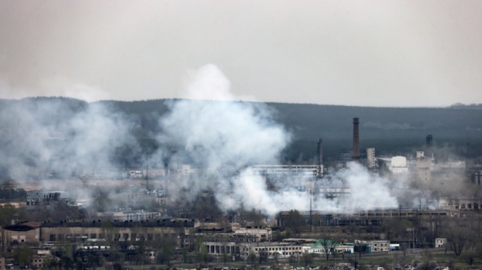 Putin honours brigade accused of atrocities as strikes hit western Ukraine