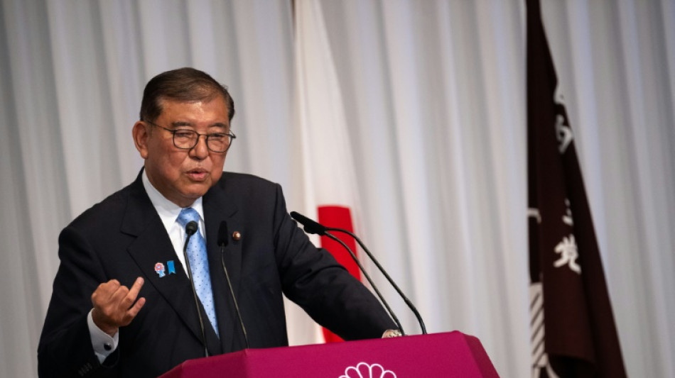 Japan PM hangs on after 'extremely regrettable' election
