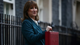 UK unveils tax-raising budget as growth downgraded