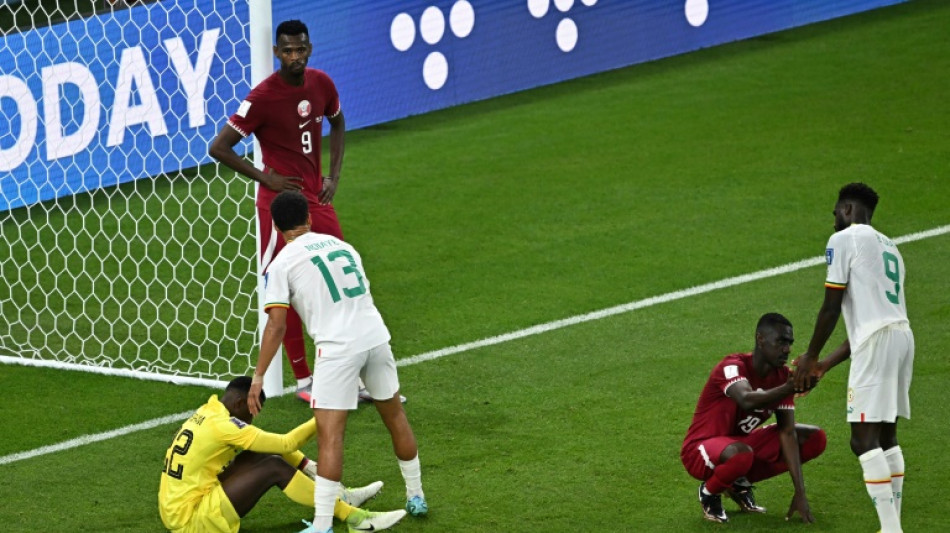 Hosts Qatar knocked out of World Cup as Iran stun Wales