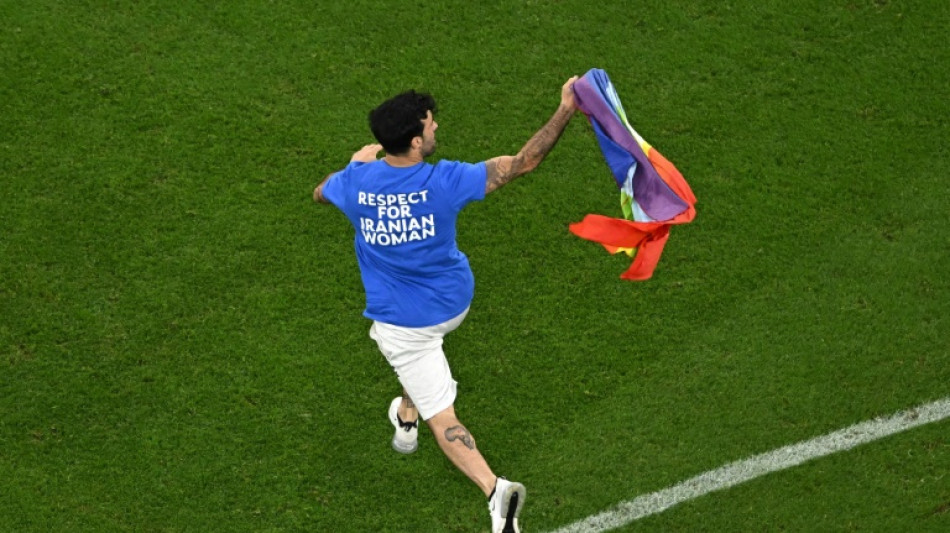 Man with rainbow flag invades pitch during World Cup match